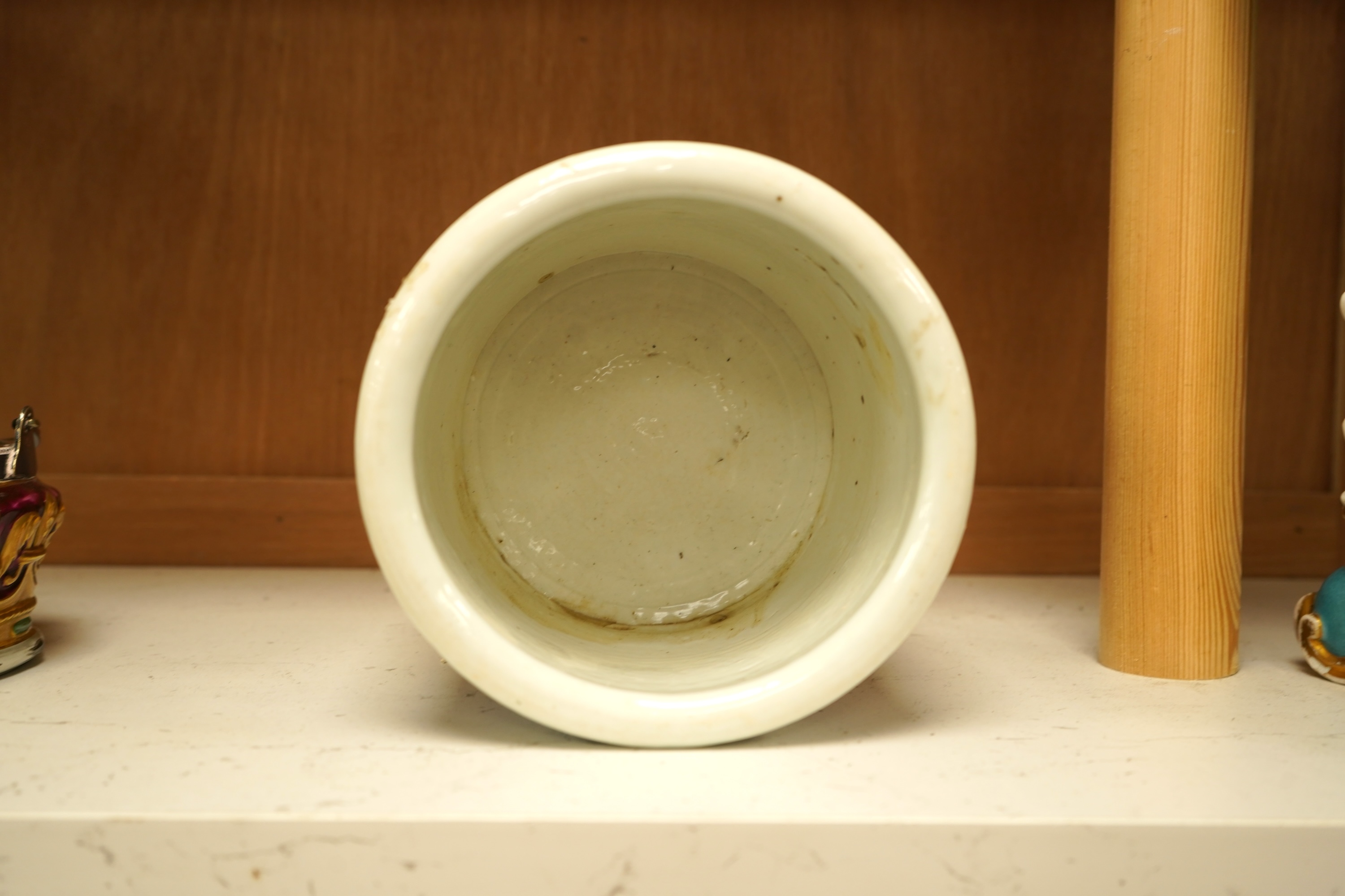 A Chinese blue and white with iron red cylindrical brush pot, 15cm in diameter